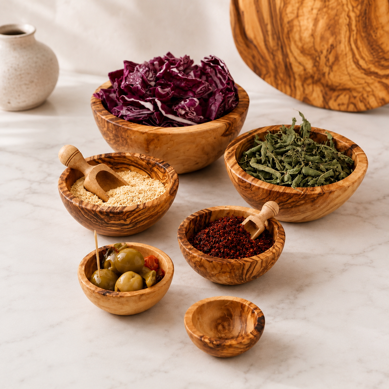 Premium Schüsselset aus geöltem Olivenholz mit warmer natürlicher Struktur und mediterraner Ausstrahlung