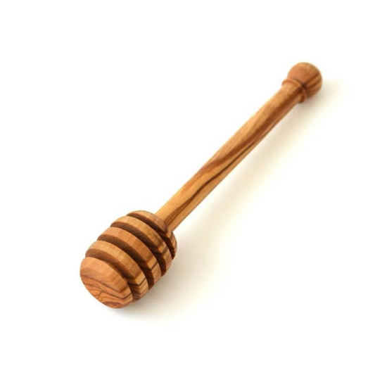 alt="Honiglöffel aus Olivenholz mit natürlicher Maserung, ideal zum Dosieren von Honig"