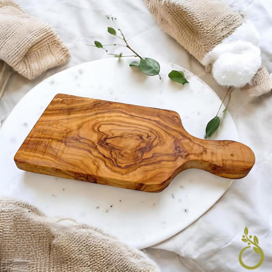 alt="Massives Schneidbrett aus Olivenholz mit Griff, ideal zum Schneiden und Servieren 25 cm"